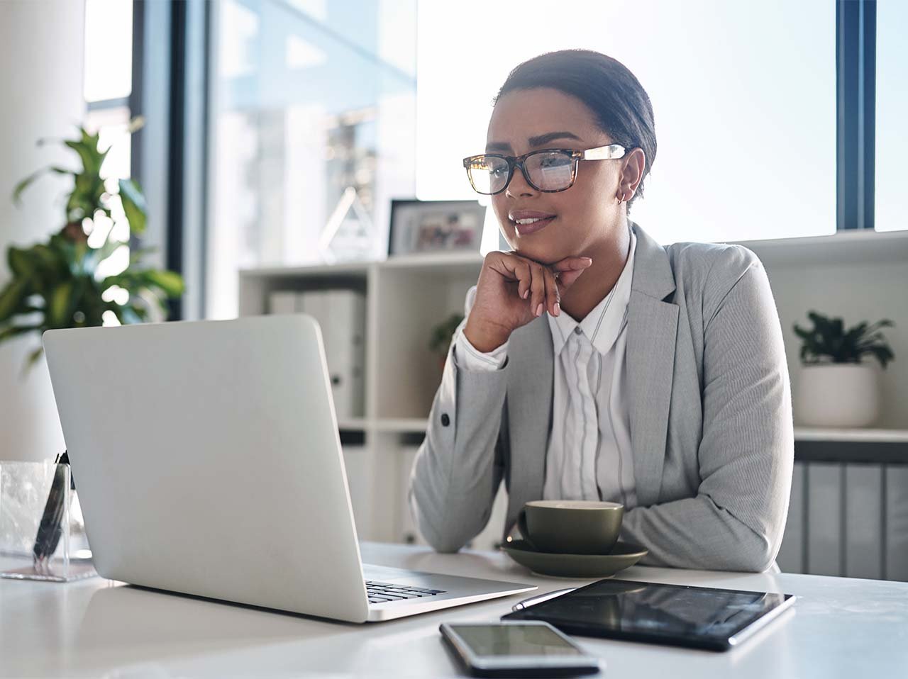 Woman reading information on a laptop.